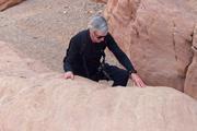 Father scaling a small dryfall in the canyon proper