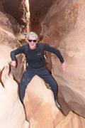 Father, having surmounted a chockstone in Little Wild Horse Canyon